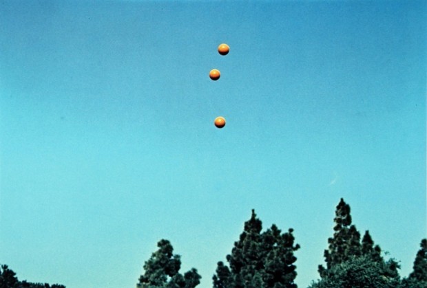 John Baldessari, " Throwing three balls in the air to get a straight line", 1973